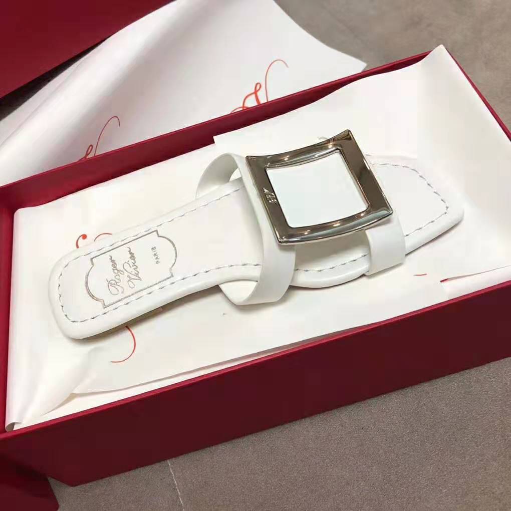 Close-up of silver buckle detail on Roger Vivier Women Bikiviv’ Mules Flat Sandals-White