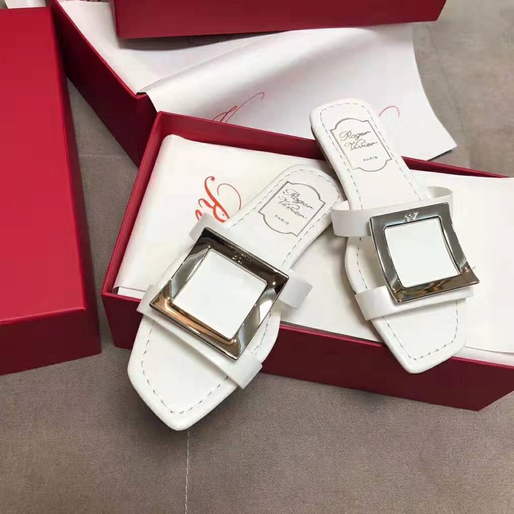 Top angle showing white leather and footbed of Roger Vivier Women Bikiviv’ Mules Flat Sandals