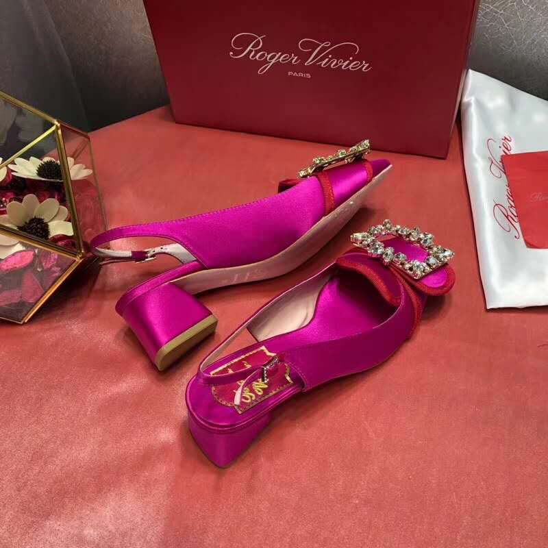 Close-up of signature crystal brooch on Roger Vivier Sling Back Pumps