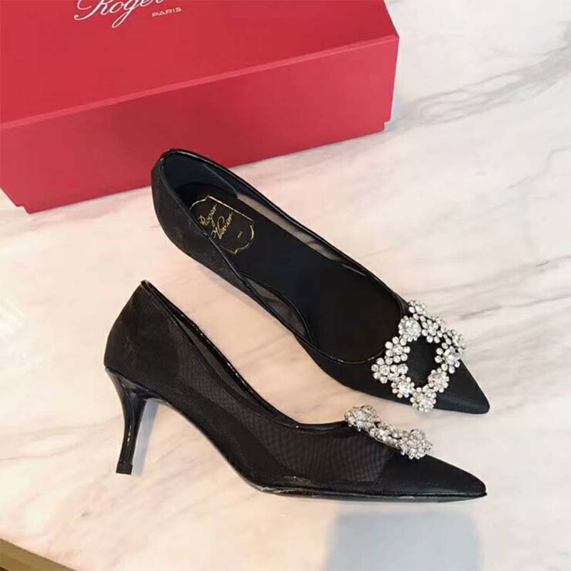 Close-up of signature flower strass buckle on Roger Vivier net pumps