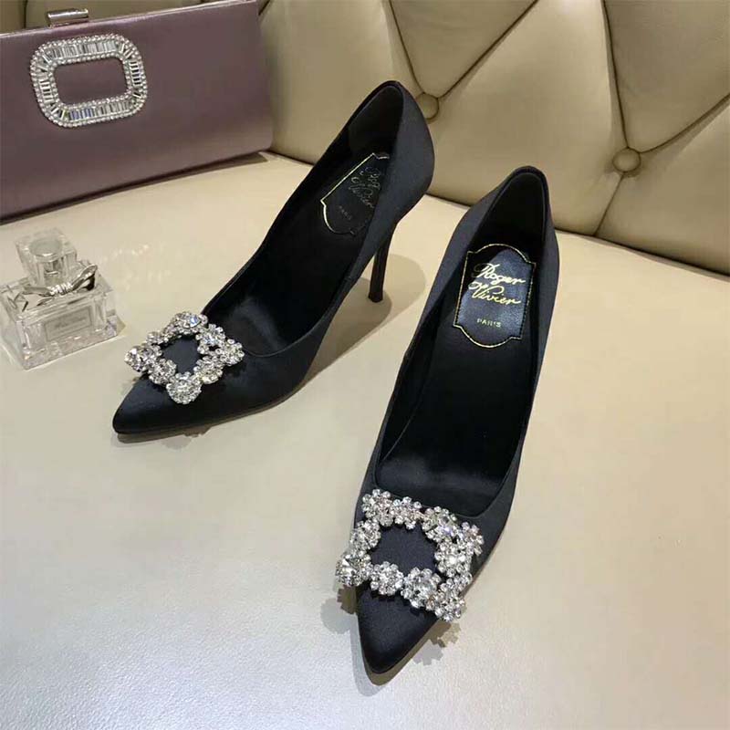 Back angle showing sleek 100mm heel of Roger Vivier black pumps