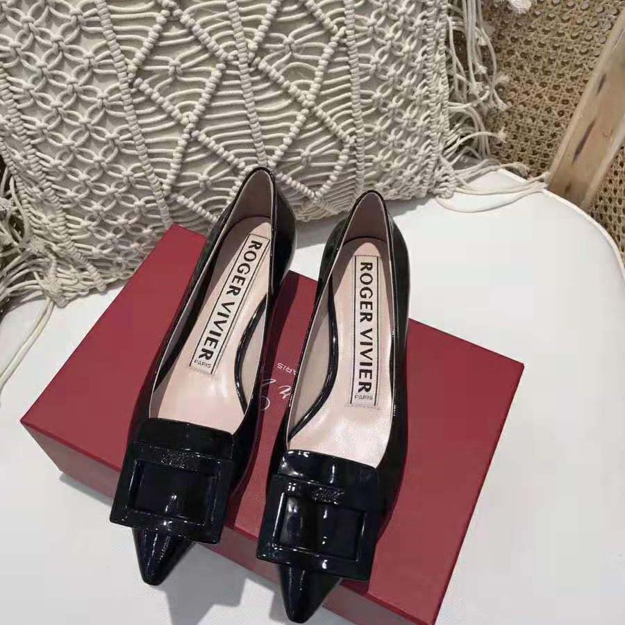 Close-up of black gommettine stud detailing on Roger Vivier ballerinas