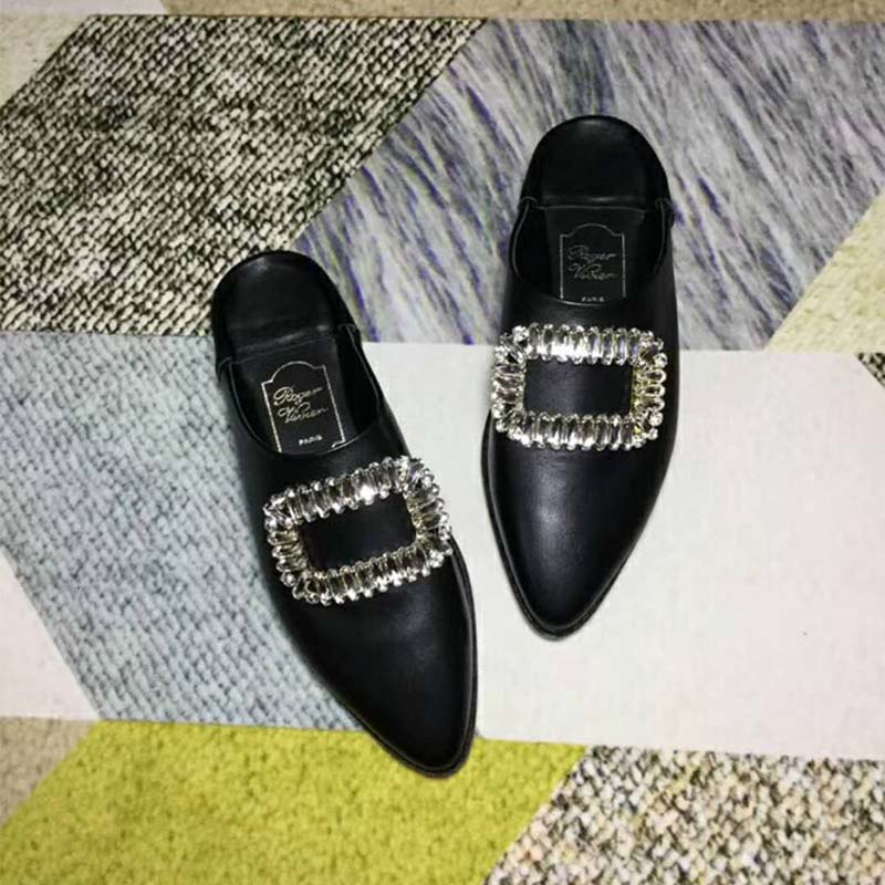 Top angle showing black leather and buckle detail on Bab’ Viv’ shoes