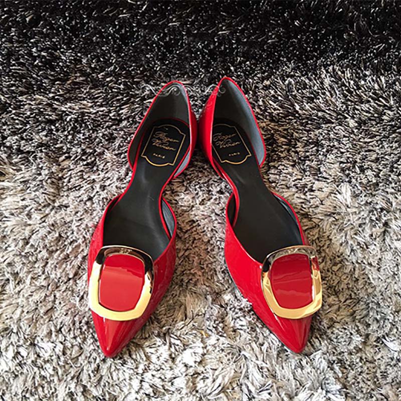 Top-down shot showing open Dorsay sides on Roger Vivier red ballerinas