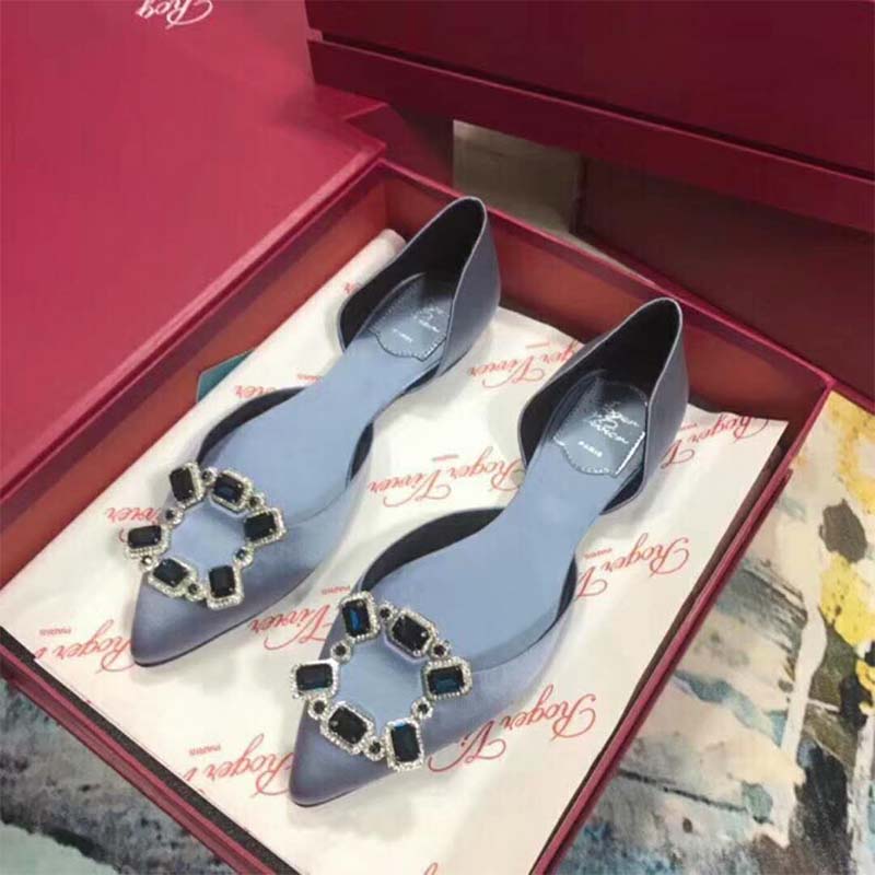 Top down shot showing blue leather and d’Orsay cut of Roger Vivier ballerinas