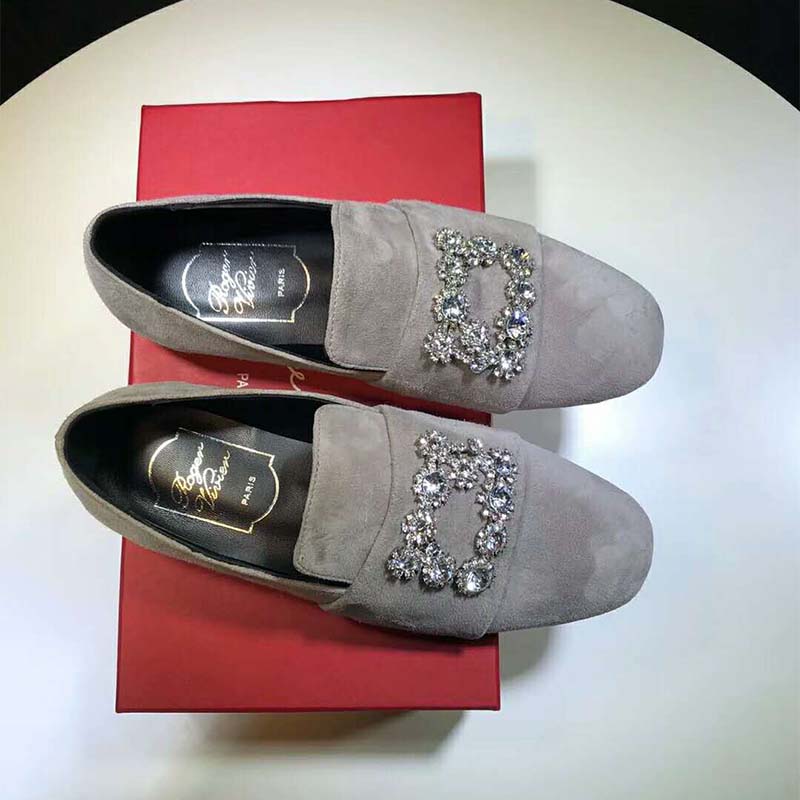 Close-up of flower strass detail on Roger Vivier silk-silver loafers