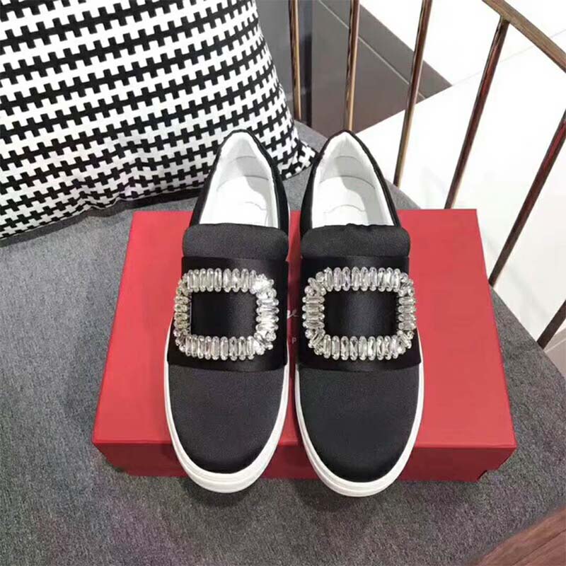 Top view showing black silk satin and lace-up detail of Roger Vivier sneakers