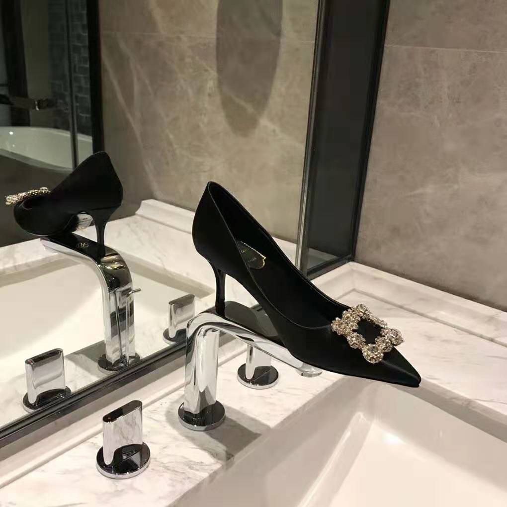 Close-up of strass flower detail on Roger Vivier Silk Pumps black