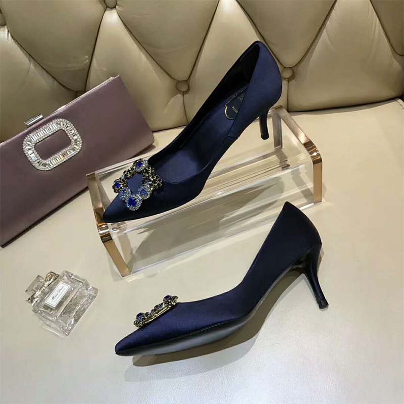 Close-up of crystal flower detail on Roger Vivier Women Silk Flower Strass Pumps