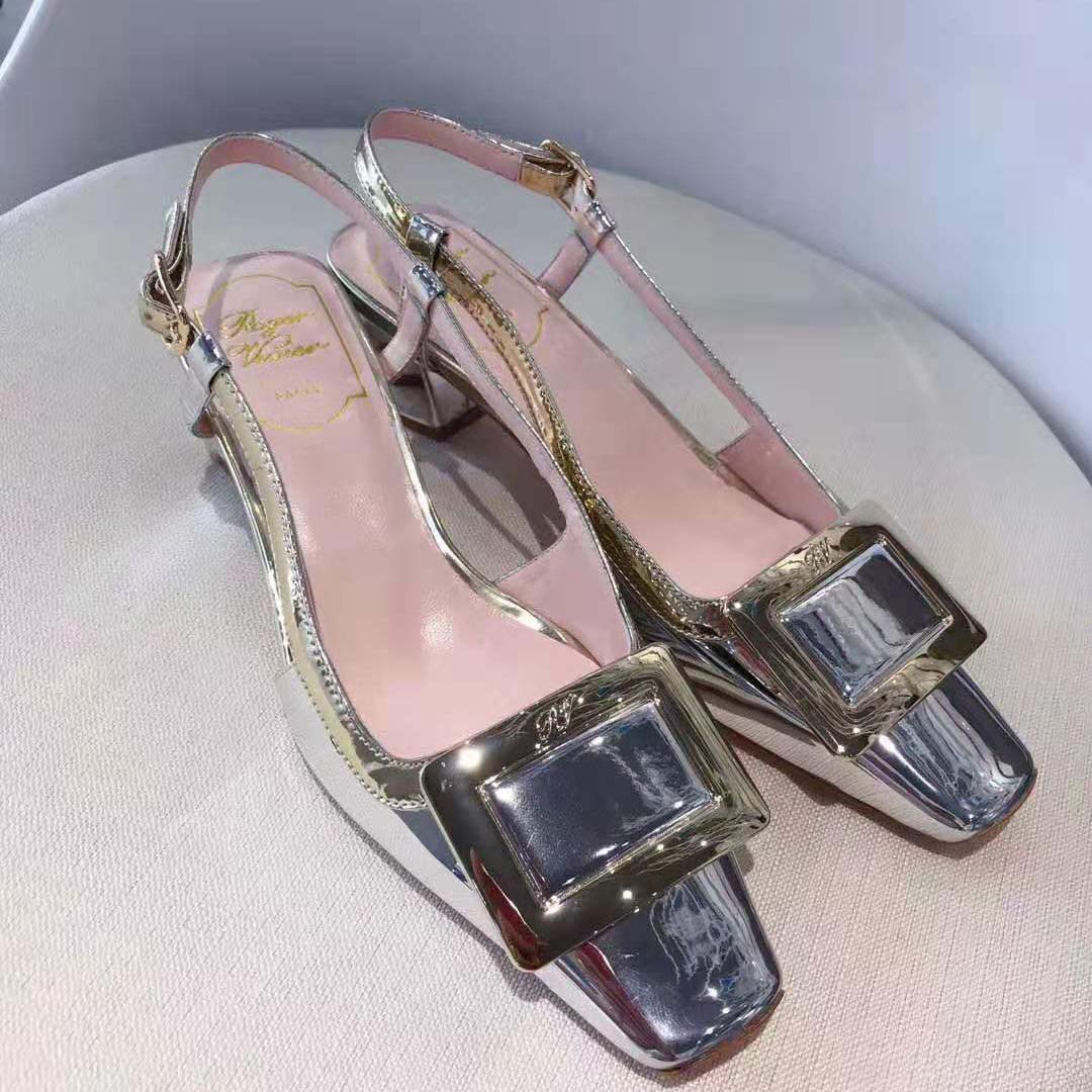 Close-up detail of silver leather and signature buckle on Vivier Pumps