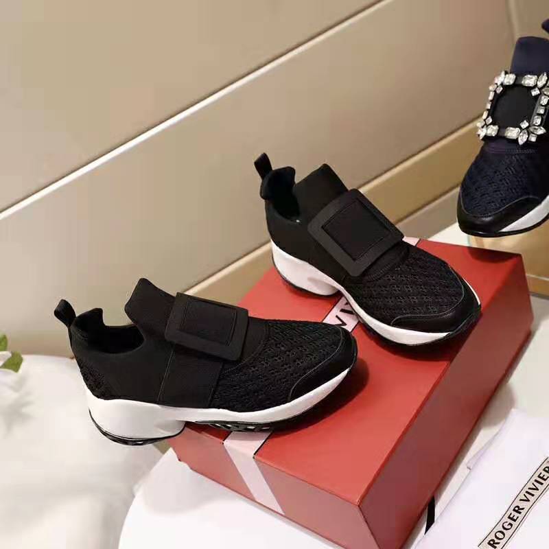 Close-up of black leather and silver buckle on Roger Vivier Viv’ Run sneakers