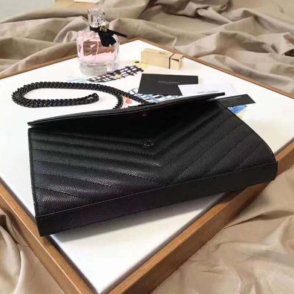 Saint Laurent Chain Wallet showing embossed leather texture and chain strap detail