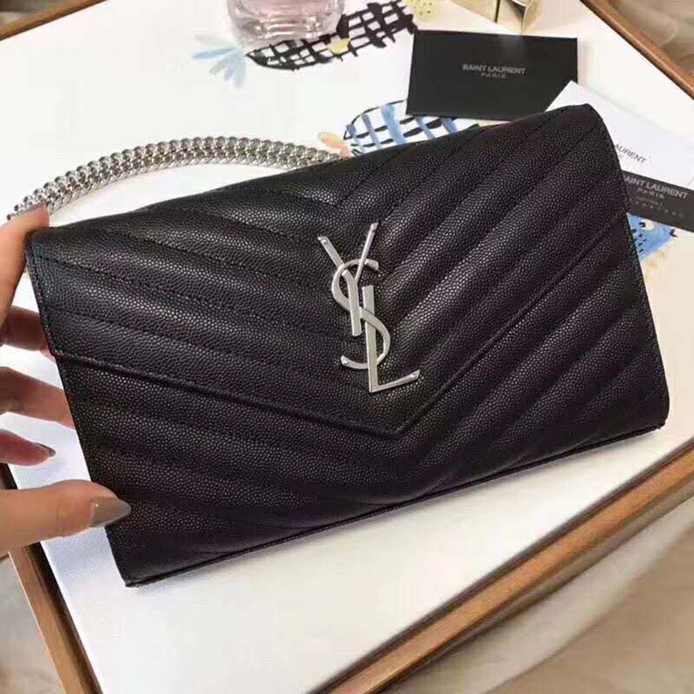 Side profile showing embossed leather texture on Saint Laurent wallet