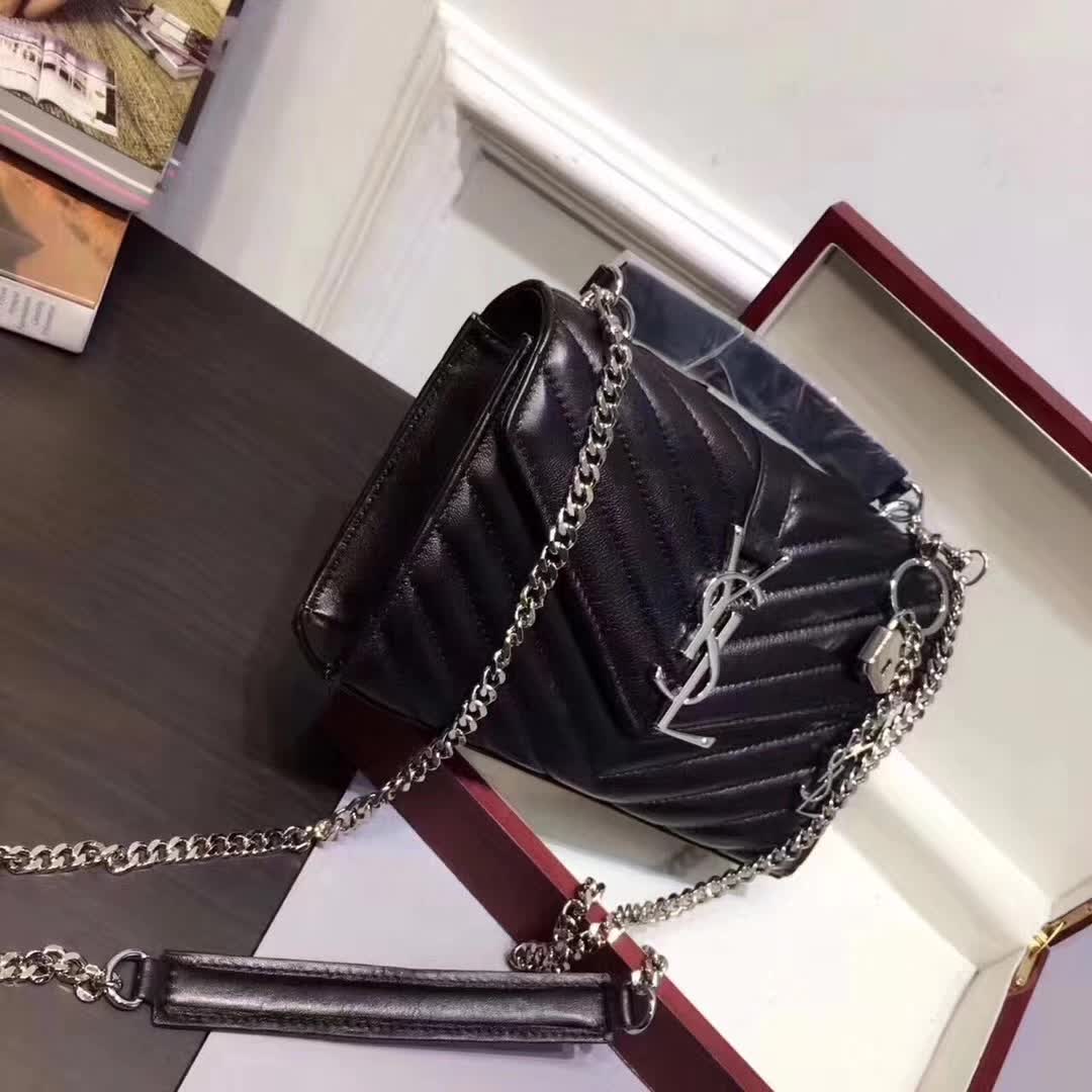 Close-up of gold YSL logo on Saint Laurent College Medium bag