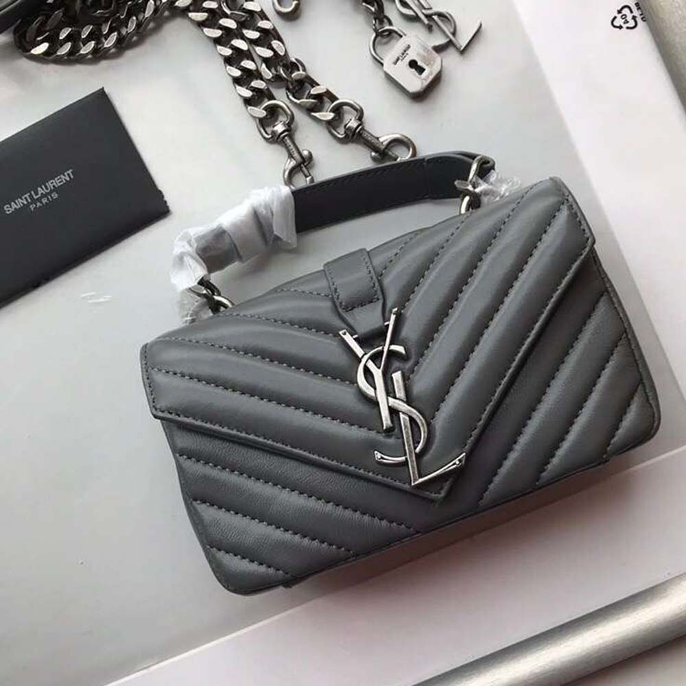 Close-up of gold YSL logo and matelassé leather texture on the bag