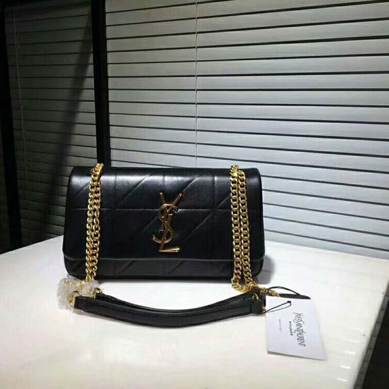 Close-up of antique gold YSL logo hardware on Saint Laurent YSL Medium Jamie Bag