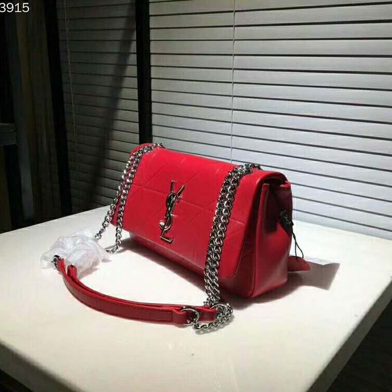 Side profile showing adjustable strap of Saint Laurent Jamie Bag red leather