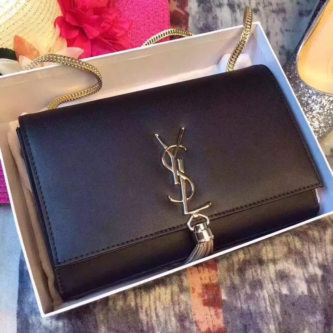 Close-up detail of YSL logo and tassel on Saint Laurent YSL Medium Kate Bag