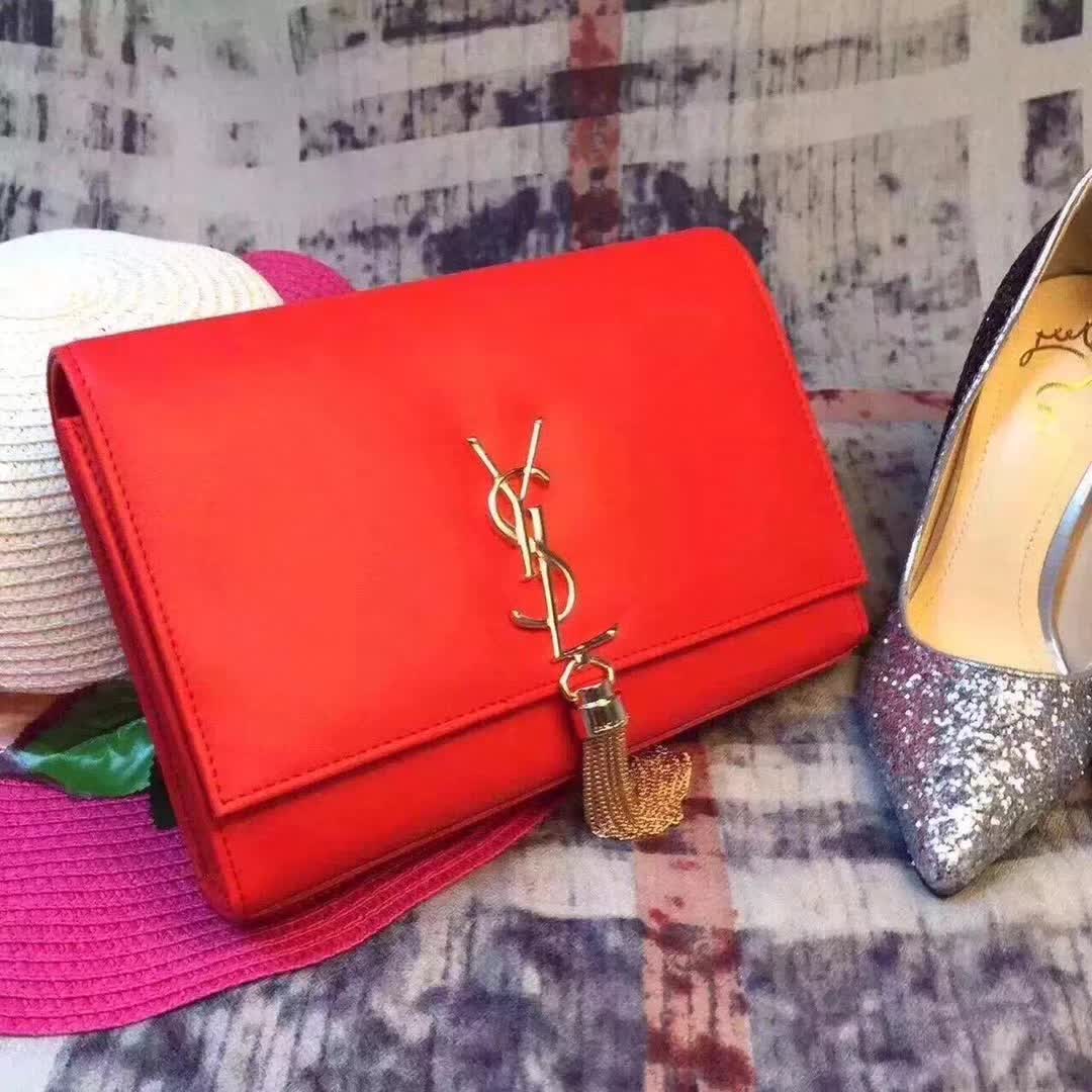 Side angle showing red calfskin leather and chain strap on Saint Laurent YSL bag
