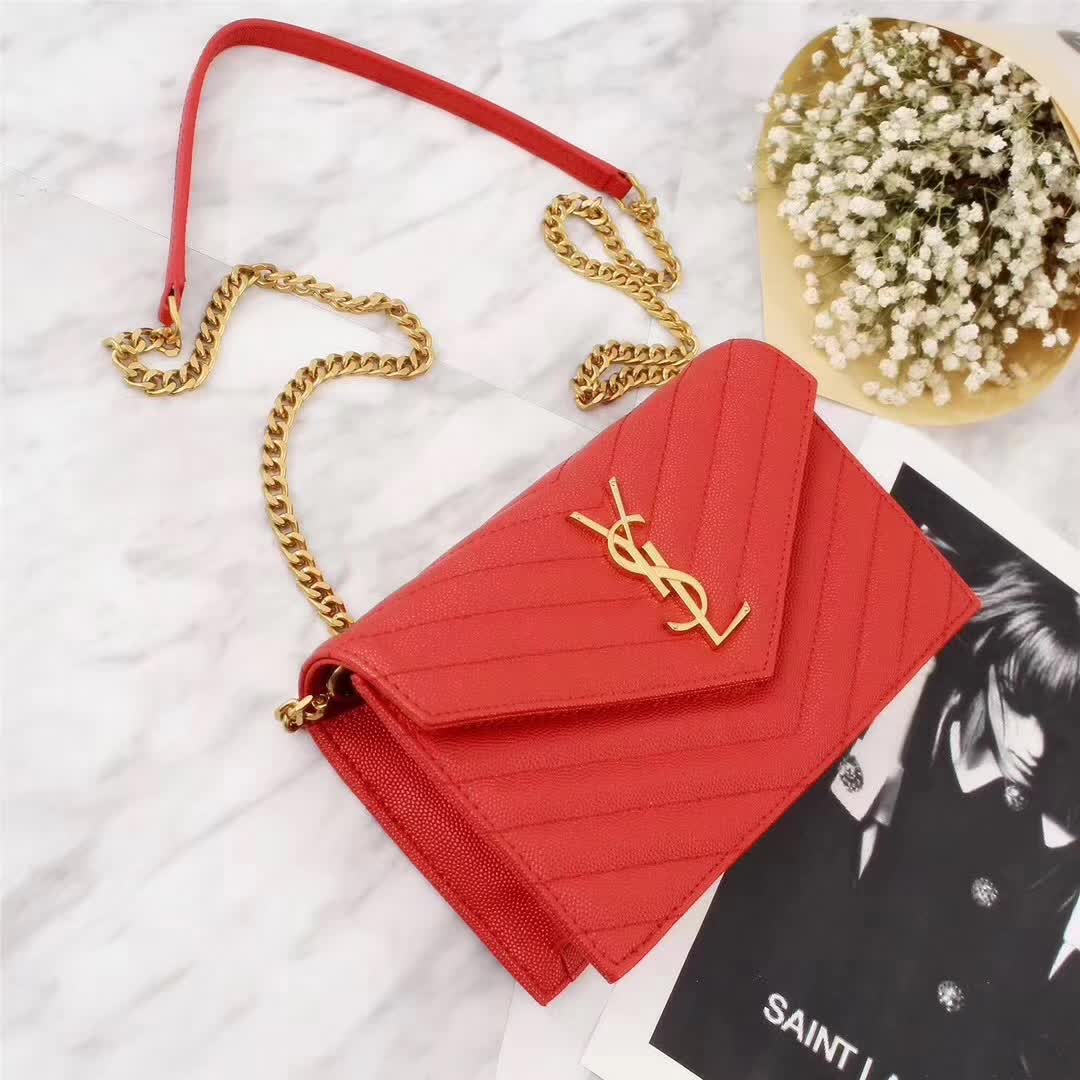 Side angle showing chain strap and envelope silhouette of Saint Laurent bag