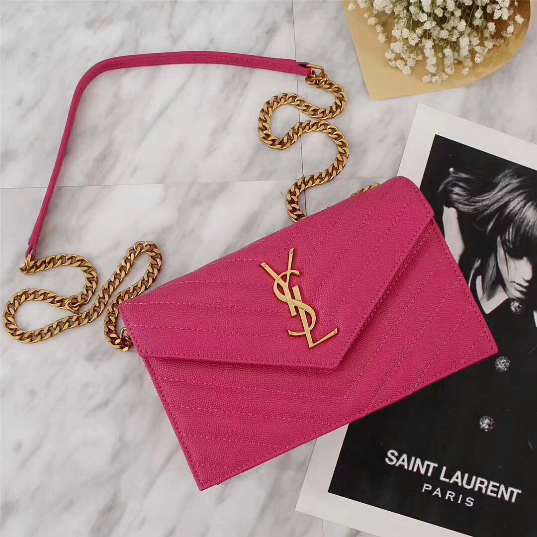 Close-up of gold YSL monogram hardware on Medium Monogram Envelope Chain Wallet Rose
