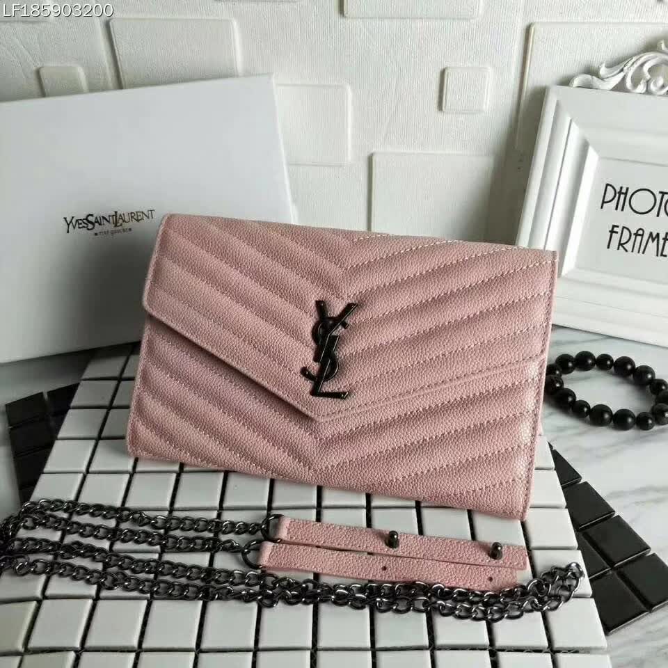 Side angle showing wallet's compact silhouette and chain strap