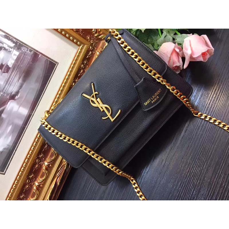 Side angle showing silhouette and flap closure of Saint Laurent Medium Sunset Bag