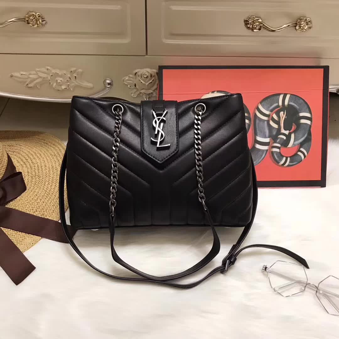 Close-up of Y-quilted leather and gold hardware on Saint Laurent YSL bag