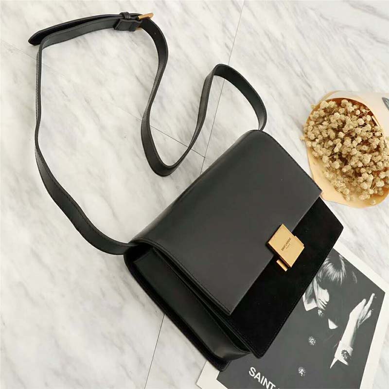 Side angle showing black leather and suede texture of Bellechasse Saint Laurent Medium bag