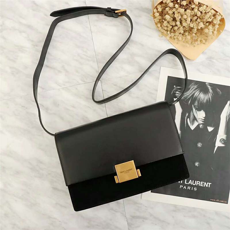 Close-up of gold YSL logo detailing on Bellechasse Saint Laurent Medium bag
