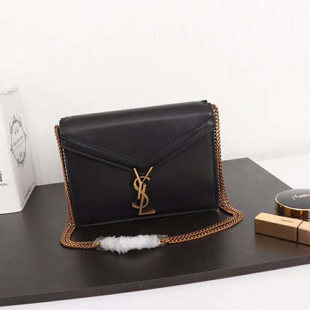 Close-up of YSL gold monogram clasp on Cassandra Monogram Clasp Bag