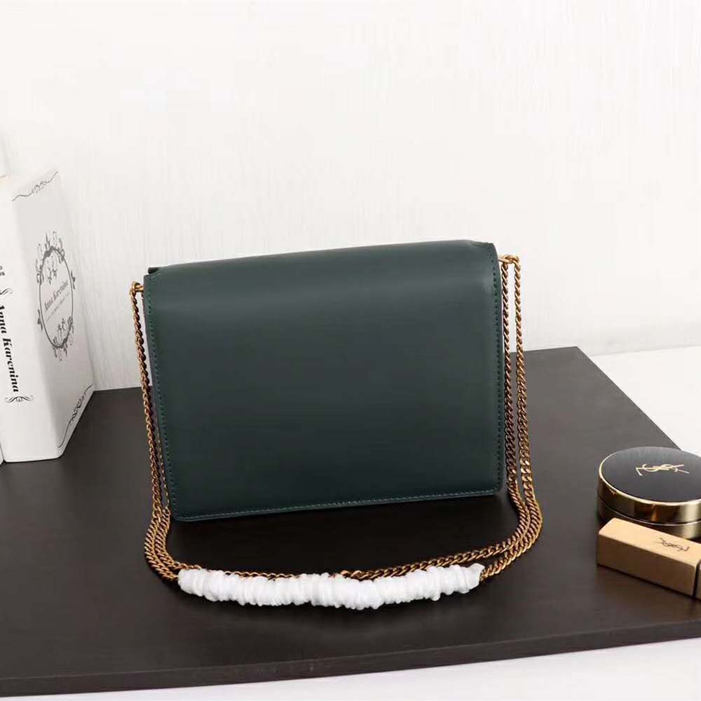 Side angle showing smooth leather and silhouette of YSL Cassandra bag