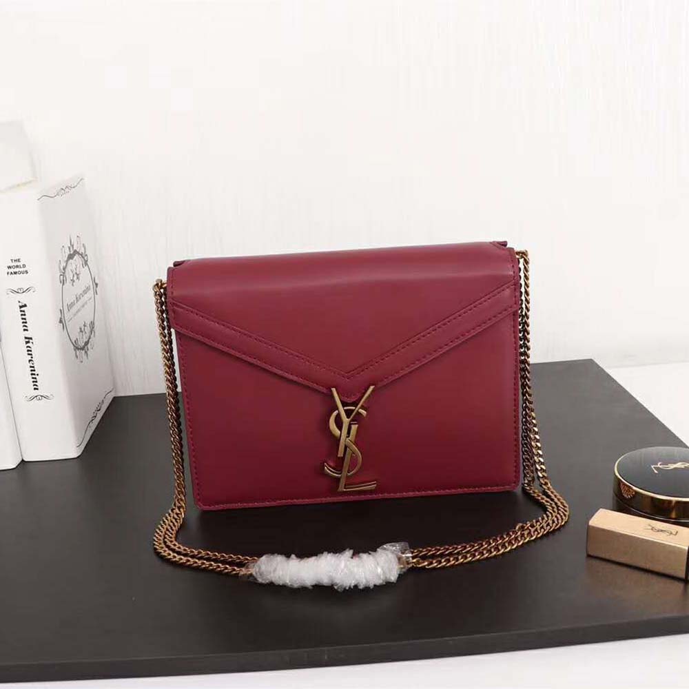 Close-up on gold YSL monogram clasp of Cassandra Monogram Clasp Bag