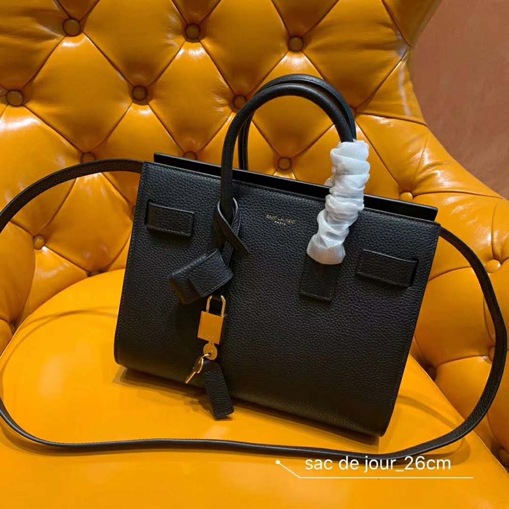 Close-up of gold YSL logo hardware on Sac De Jour Baby Grained bag