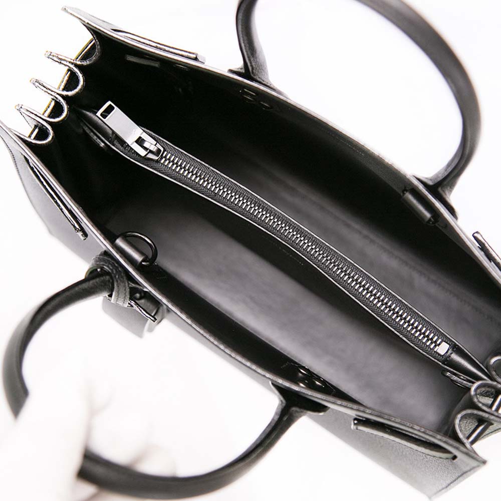 Side angle showing smooth grey leather texture on Saint Laurent YSL bag