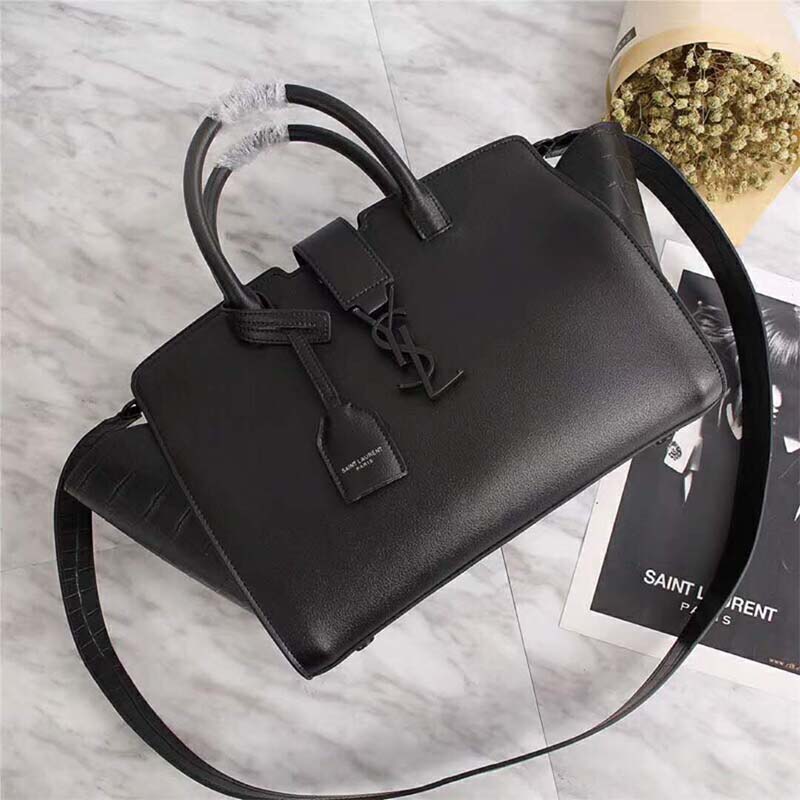 Close-up of gold-tone YSL hardware on Saint Laurent Downtown Small Cabas bag