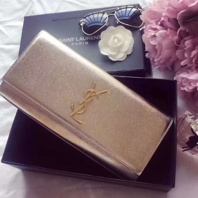 Close-up of silver YSL logo on Kate Clutch metallic leather