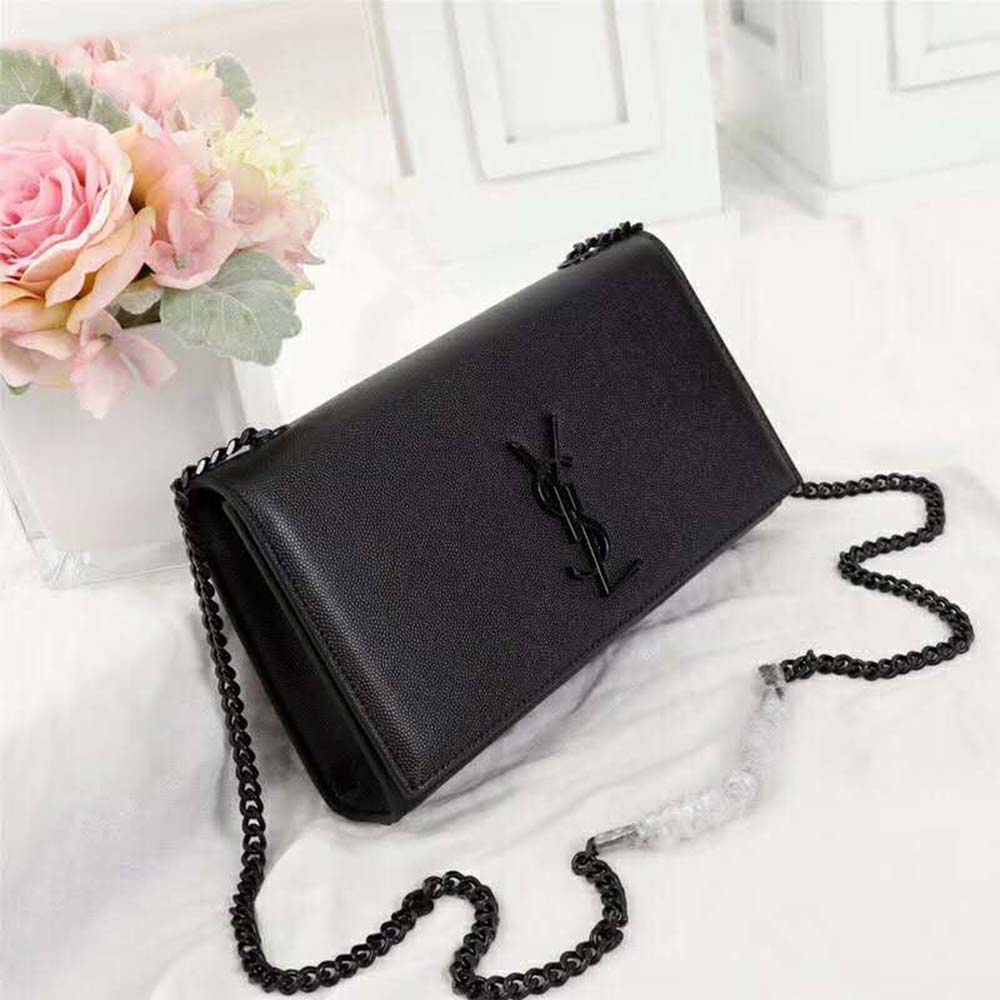 Side angle showing chain strap and magnetic flap of Kate Medium bag