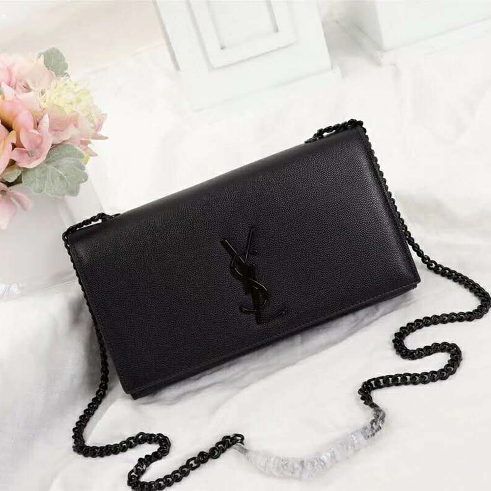 Close-up on gold YSL logo and grain de poudre embossed leather detail