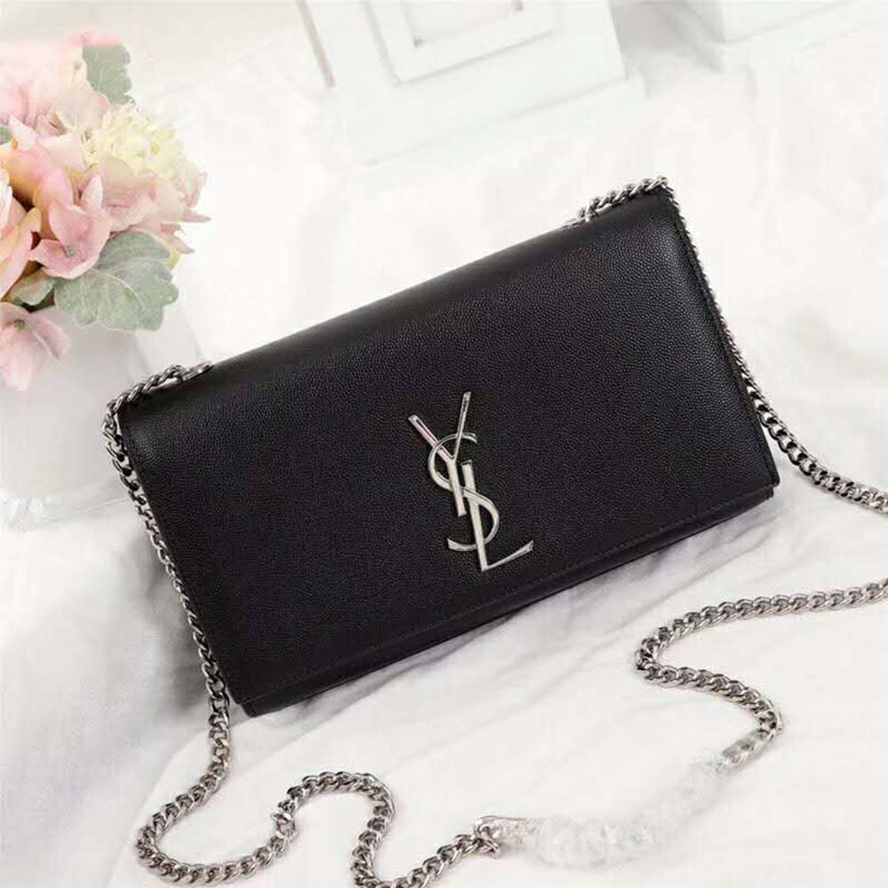 Close-up of silver YSL logo and embossed leather detail on Kate Medium bag
