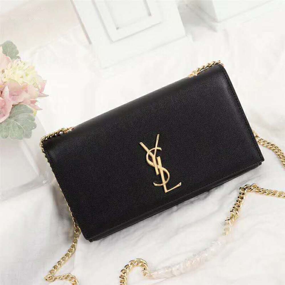 Close-up of embossed gold YSL logo hardware on the Saint Laurent Kate bag