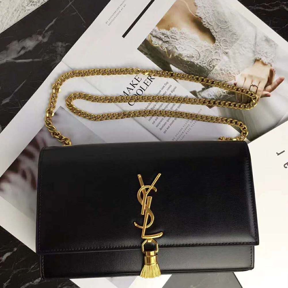 Close-up of gold YSL logo and tassel detail on Kate Medium bag