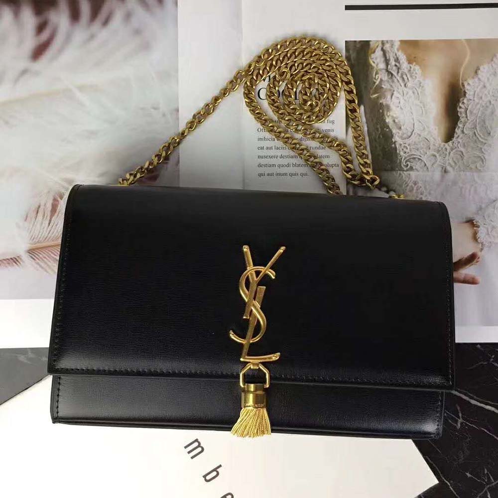 Side angle showing smooth black leather texture on Saint Laurent Kate bag