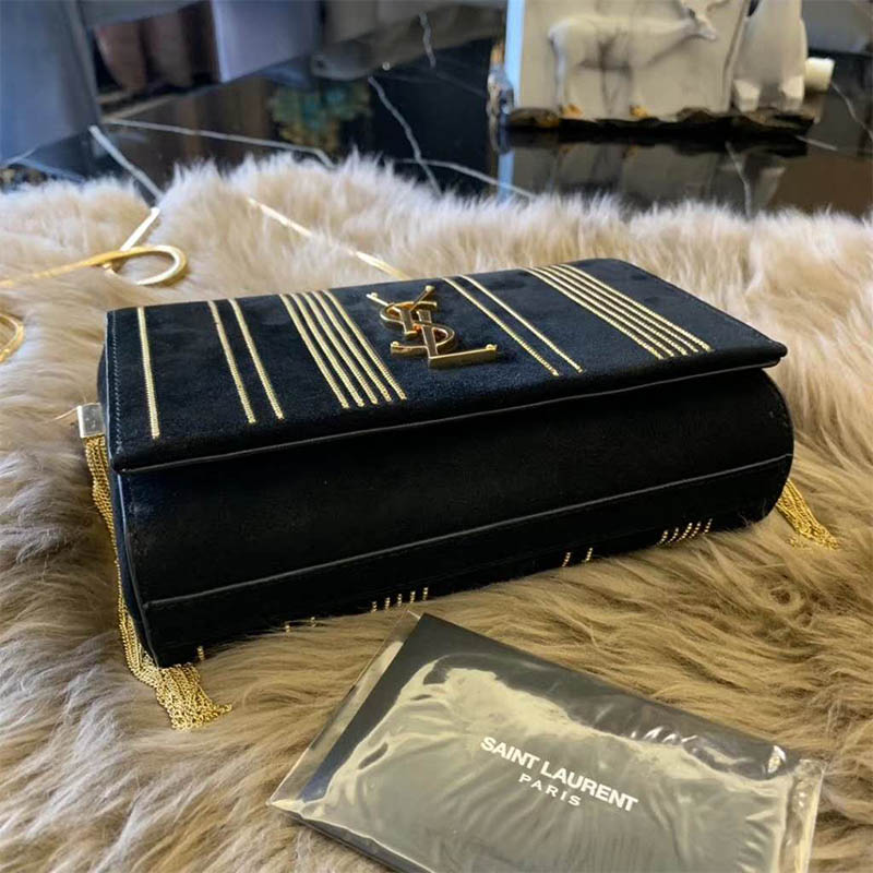 Side profile showing textured black suede on Saint Laurent Kate bag