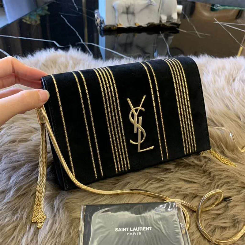 Close-up of silver YSL chain on Kate Small Suede black bag
