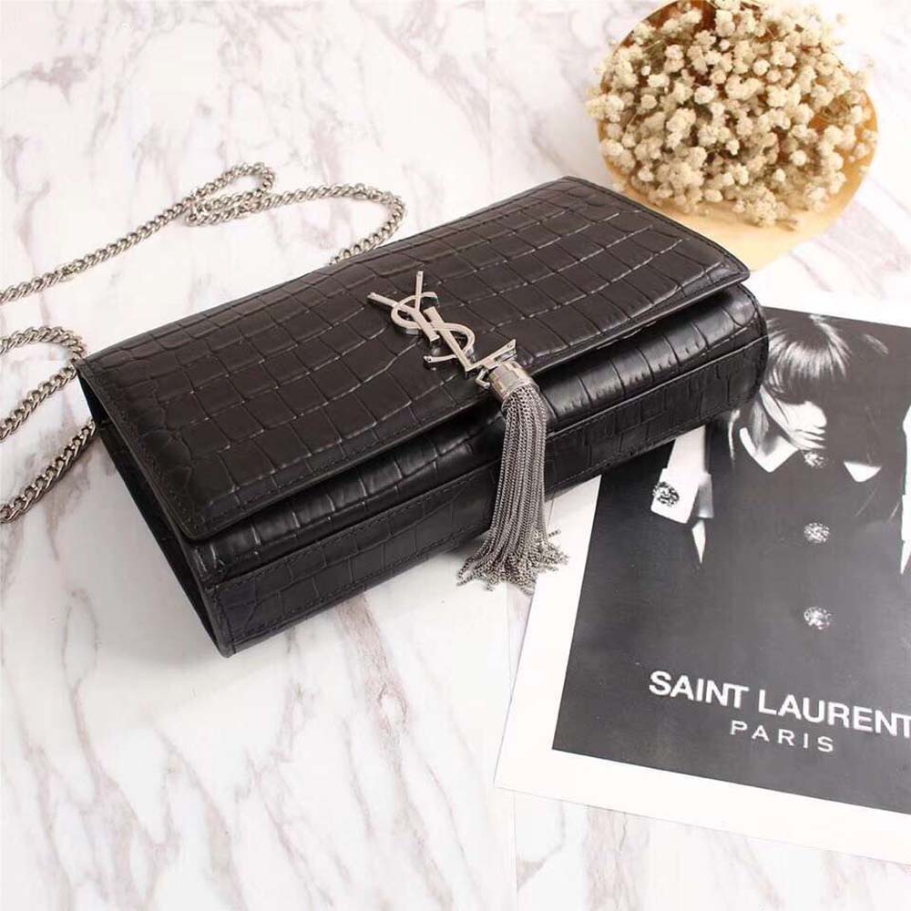 Side angle showing tassel detail and compact silhouette of Saint Laurent Kate bag