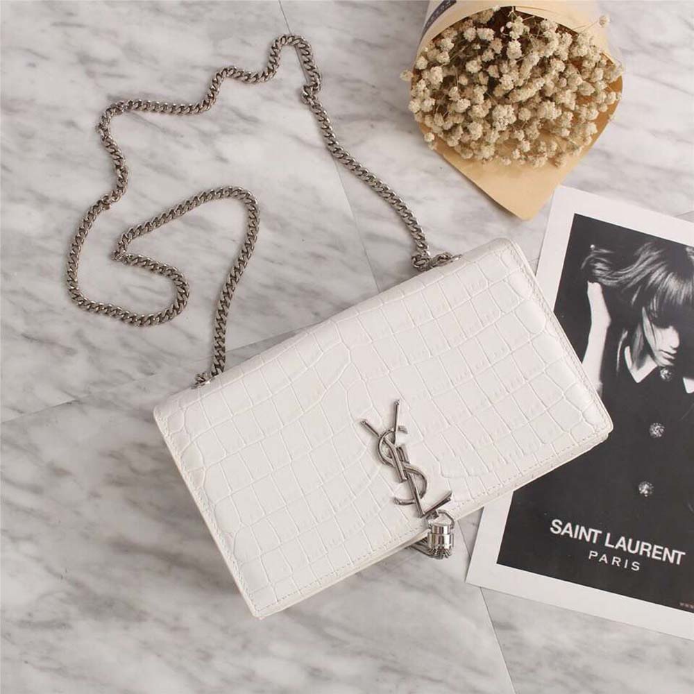 Close-up on gold tassel detail and embossed crocodile texture, Saint Laurent YSL Kate Small