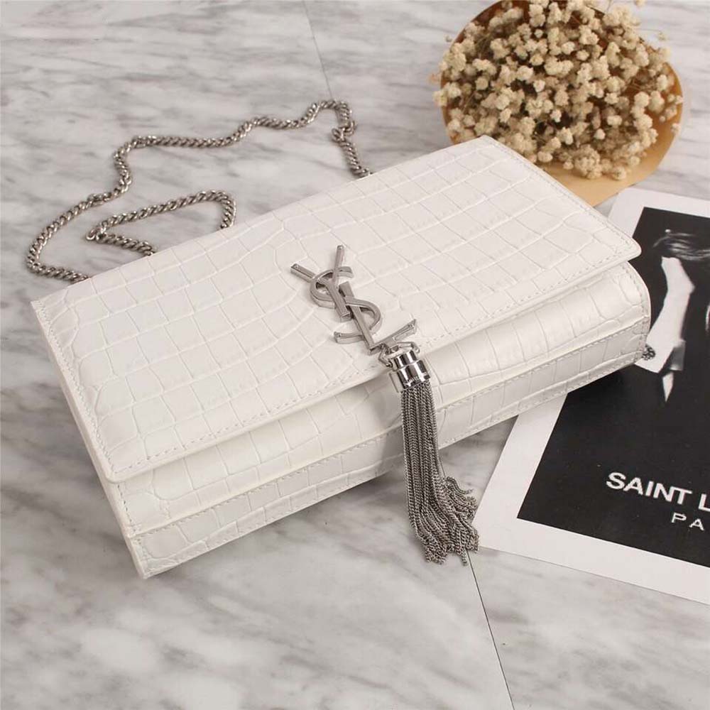 Side angle showing white shiny calfskin and chain strap of Saint Laurent YSL Kate Small bag