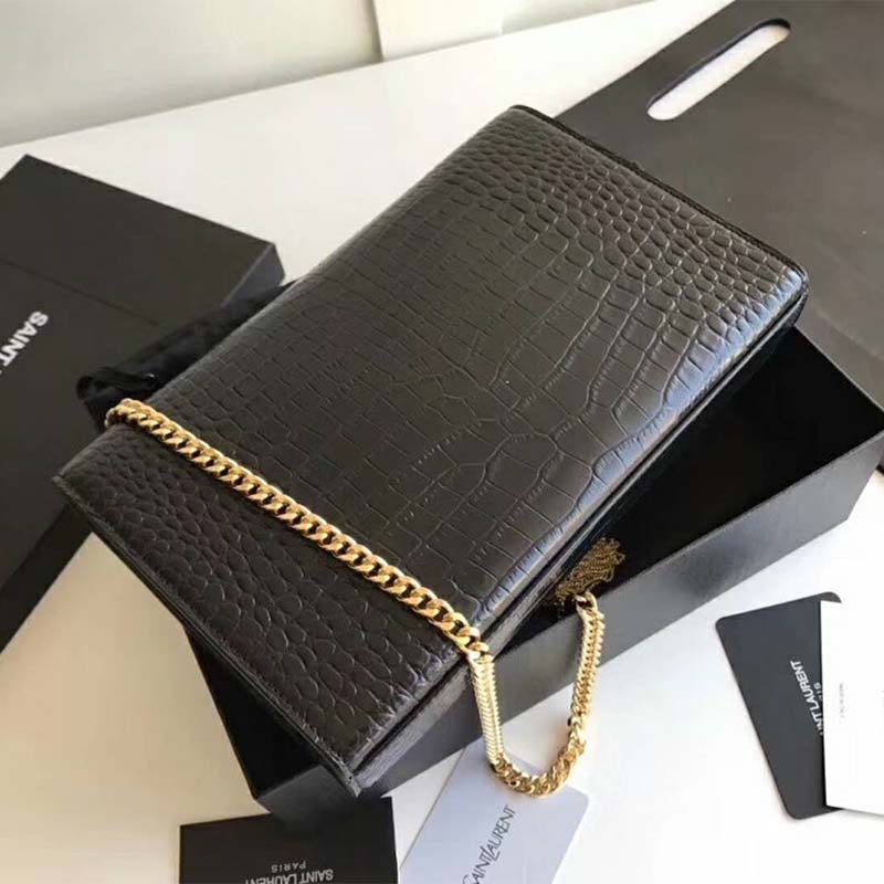 Side angle showing compact silhouette of Saint Laurent YSL Women Kate Small Tassel bag