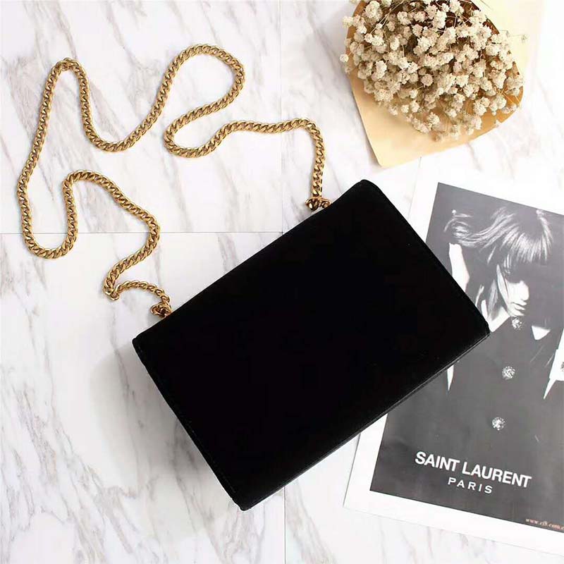 Side profile showing velvet texture and chain strap of Saint Laurent Kate Small
